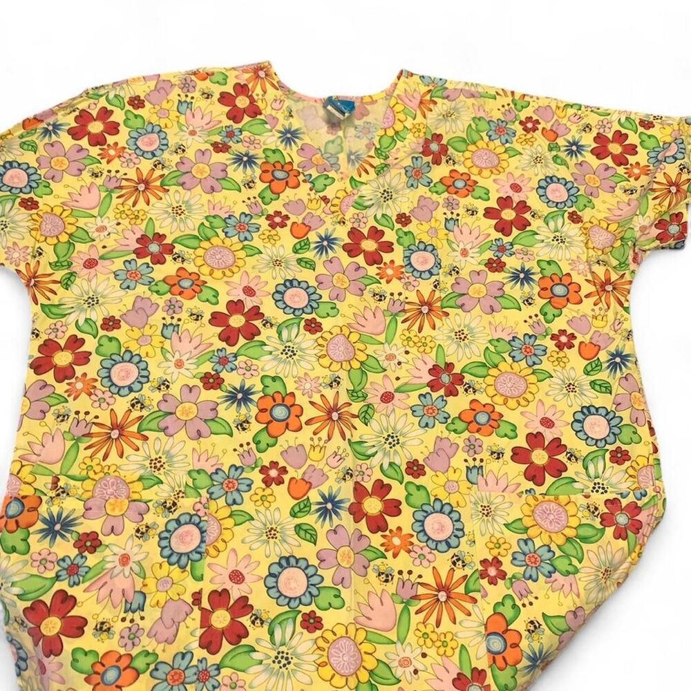 Yellow floral print scrubs . Size: L